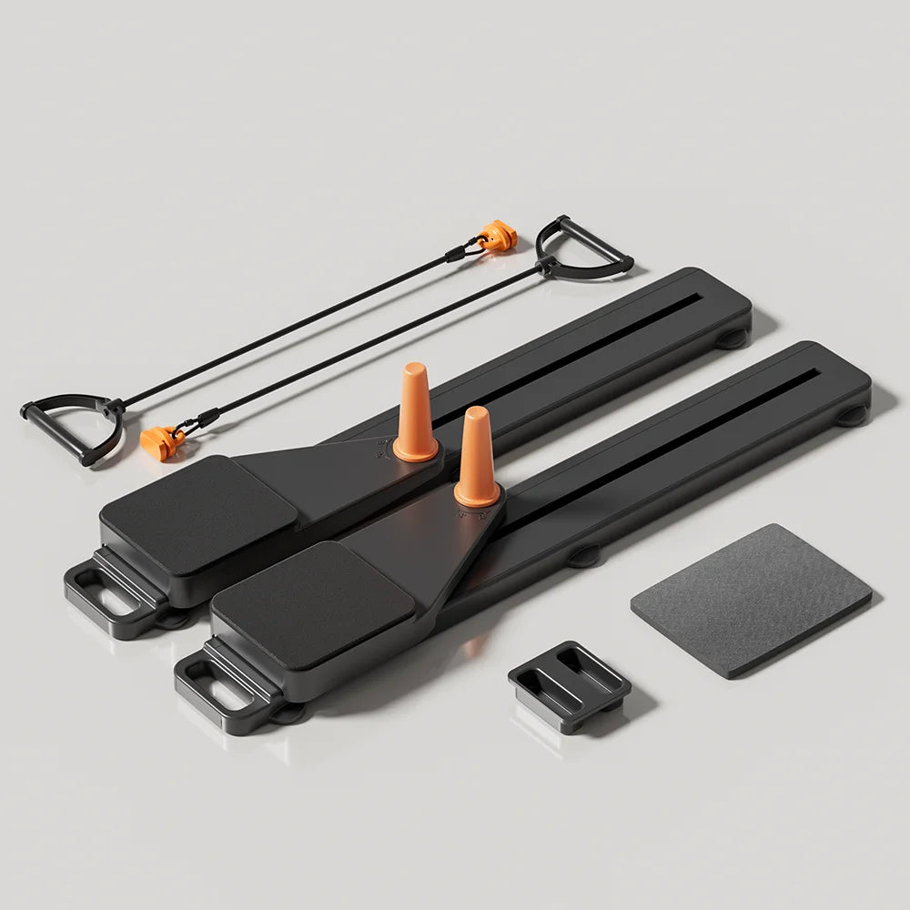 Black exercise equipment with orange cones on a gray background