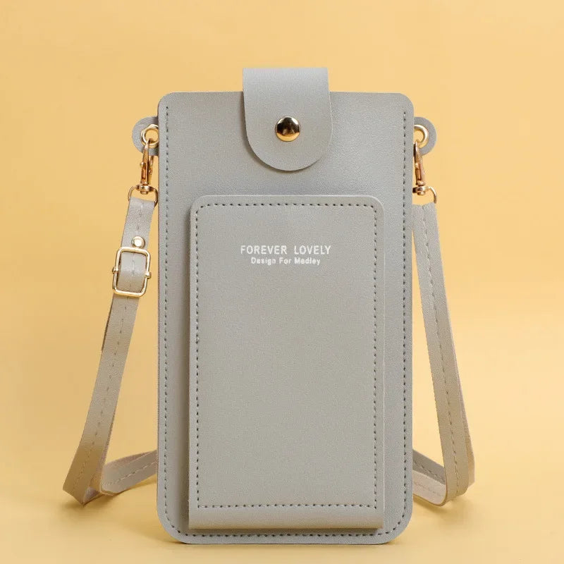 Gray crossbody bag with 'Forever Lovely' text on a yellow background