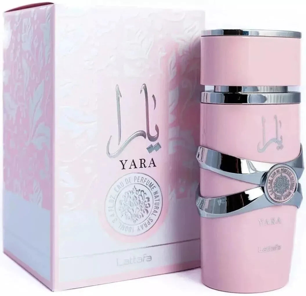 Pink Yara perfume bottle with silver accents and packaging on a white background