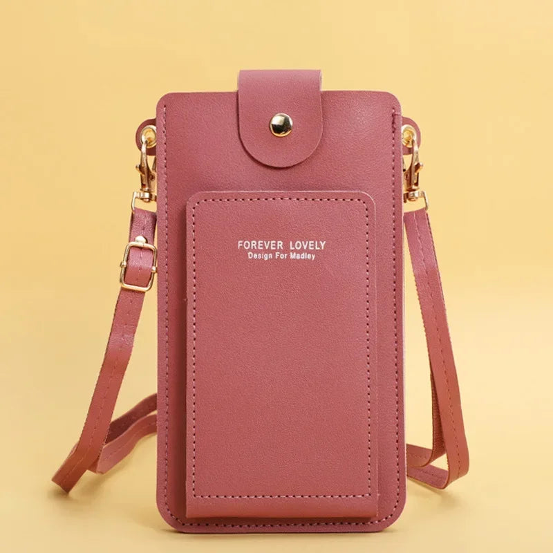 Pink crossbody bag with 'Forever Lovely' text on a yellow background