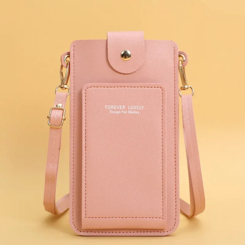Pink phone pouch with strap on a yellow background