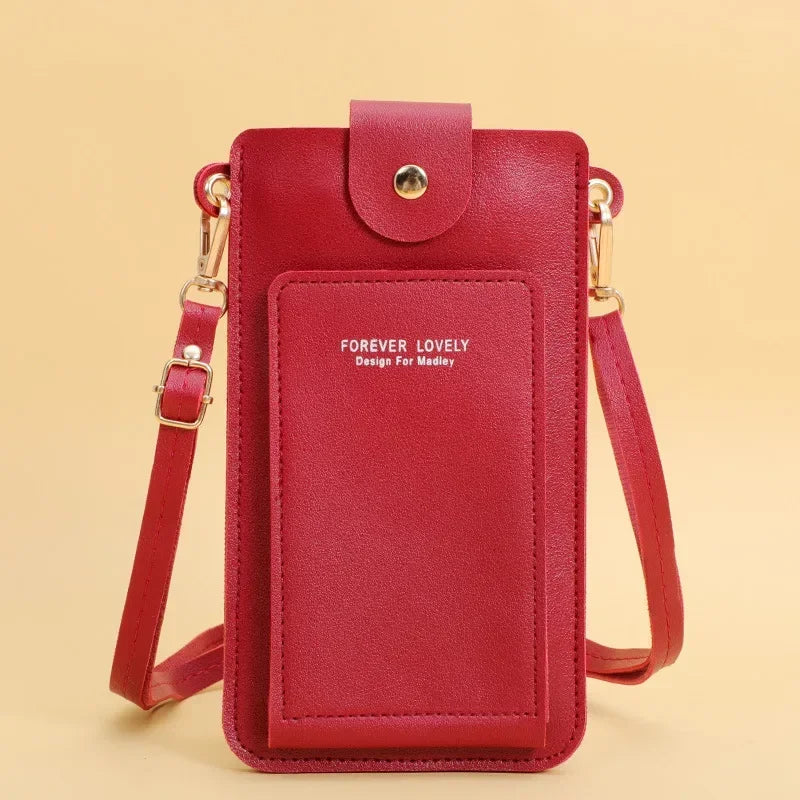 Red crossbody bag with 'Forever Lovely' text on a beige background
