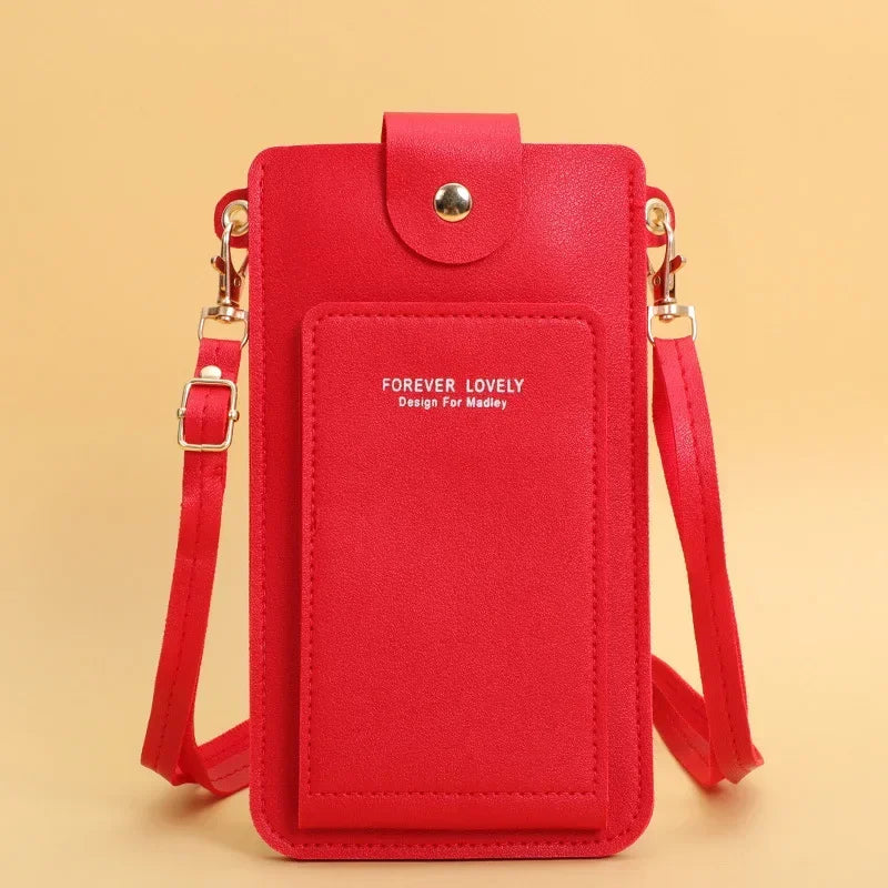 Red crossbody bag with 'Forever Lovely' text on a beige background