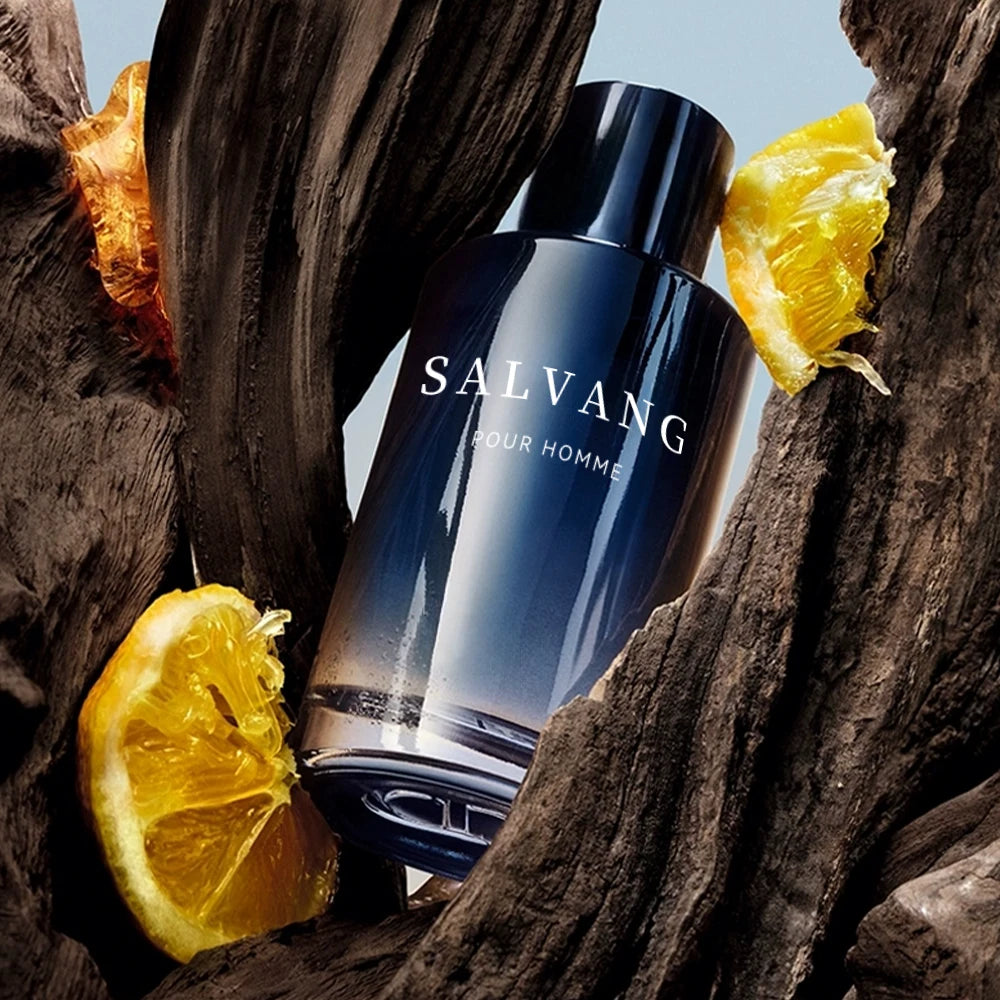Salvang pour Homme bottle surrounded by orange slices on a wooden background