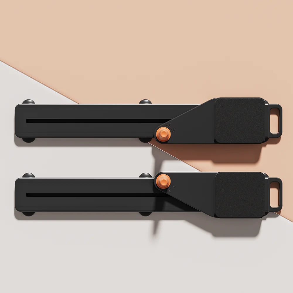 Two black metal brackets with orange screws on a beige and white background
