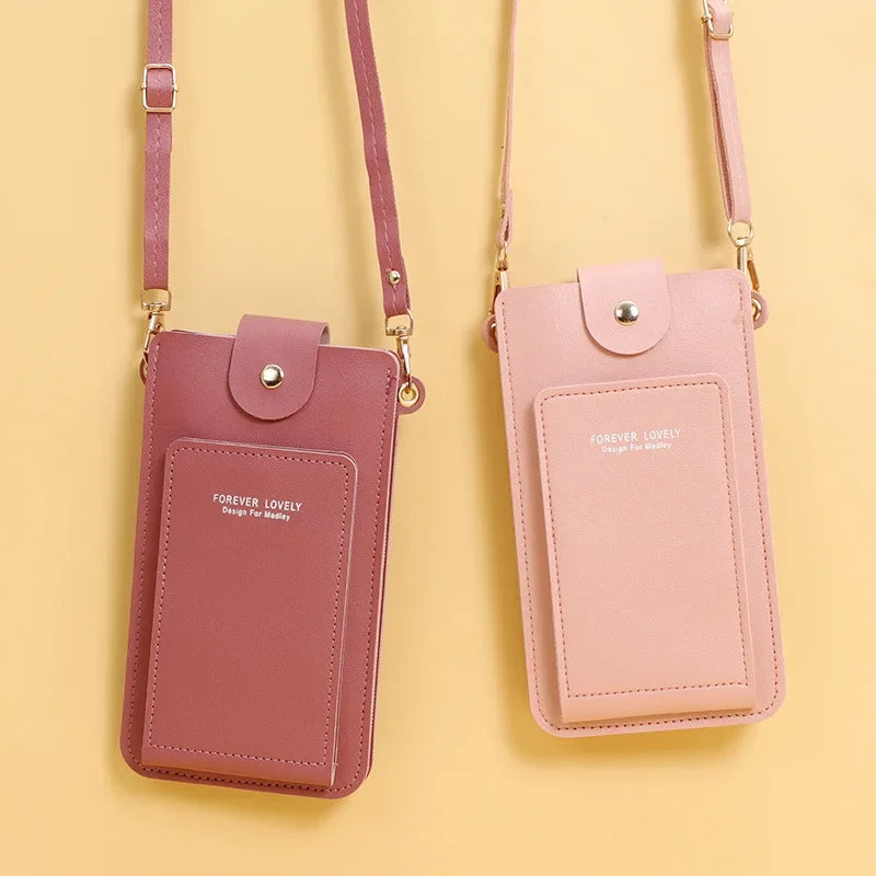 Two pink phone pouches with straps on a yellow background