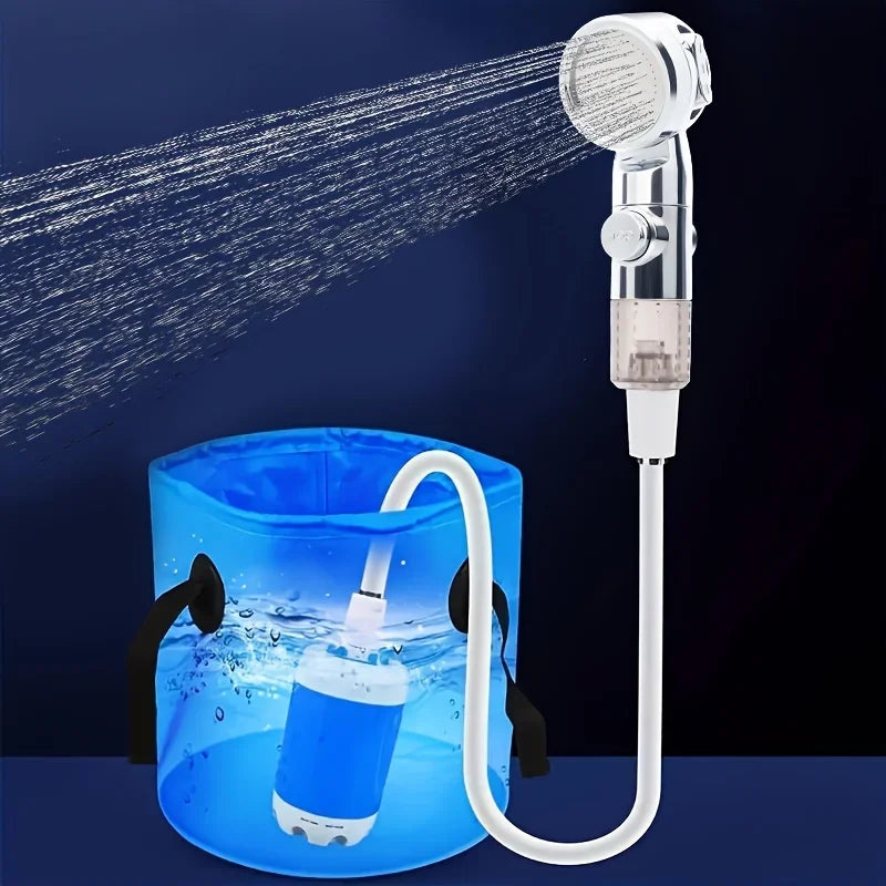 Shower head with hose and bucket filled with water on a dark background